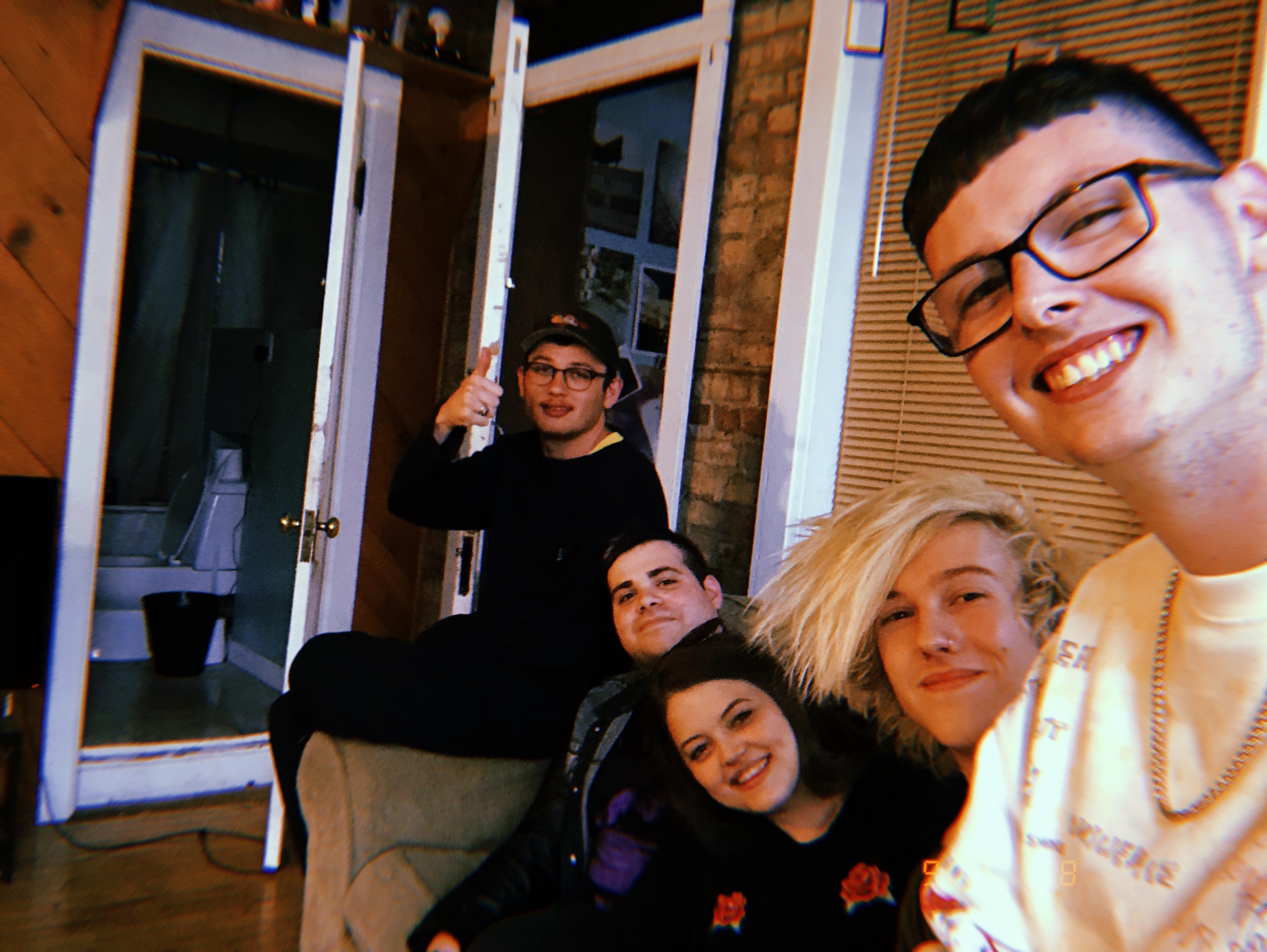 Alex, Kayla, Ryan, and Euan inside the Take This to Your Grave apartment, September 2018